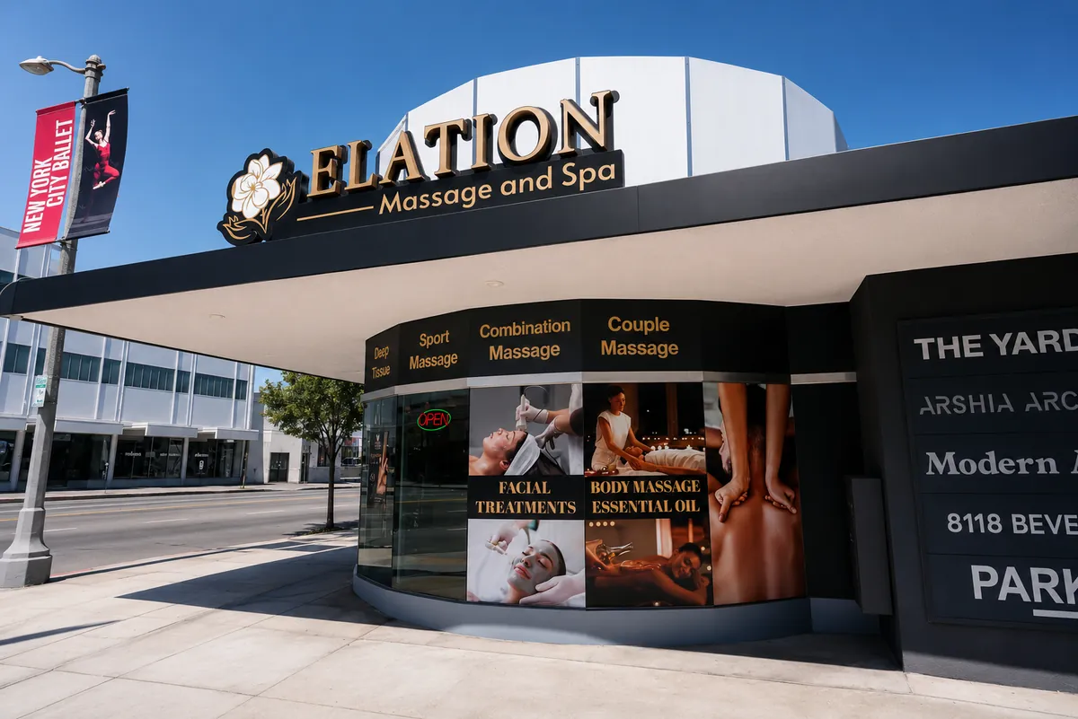 Daytime exterior of Elation Massage & Spa with gold signage