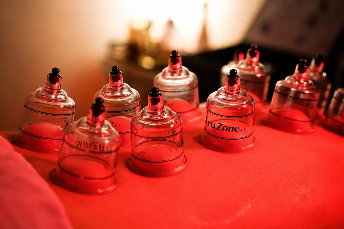 Cupping therapy cups arranged on a massage table